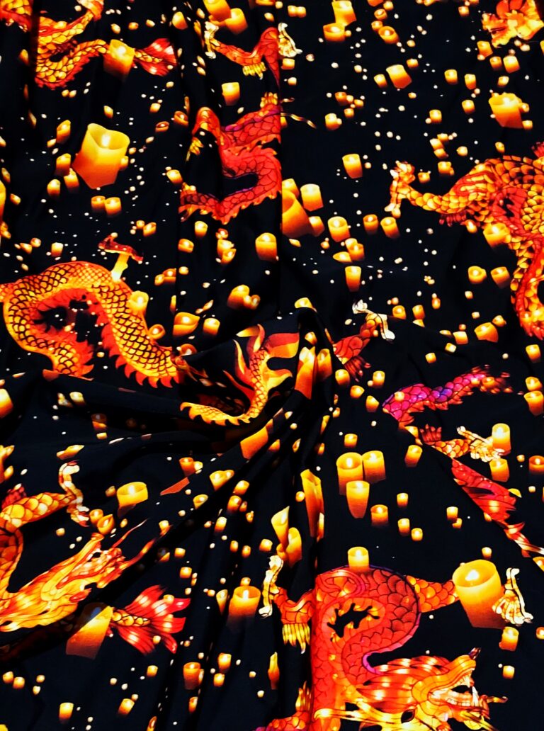 Dragons and lanterns on black fabric background