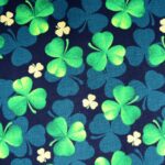 Green shamrocks pattern on dark background.