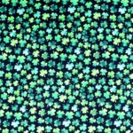 Pattern of green shamrocks on dark background.