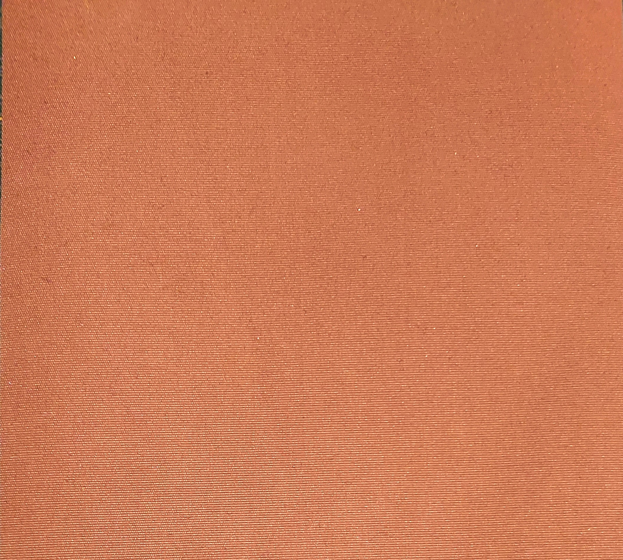 Orange textured fabric with subtle pattern.
