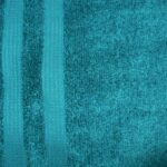 Teal textured towel with vertical stripes.