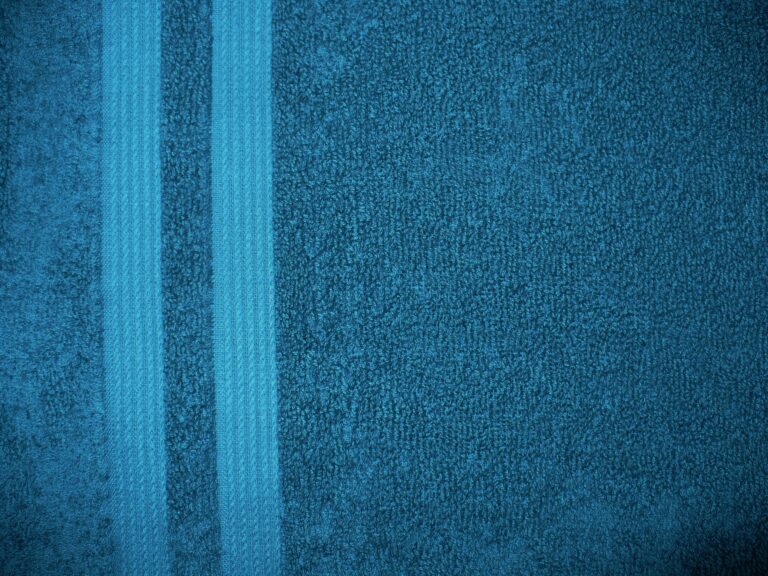 Blue textured towel with two vertical stripes