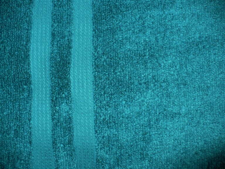 Teal textured towel with vertical stripes