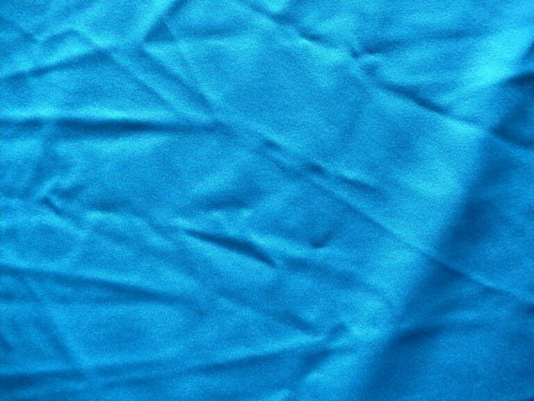 Wrinkled blue fabric texture, close-up view