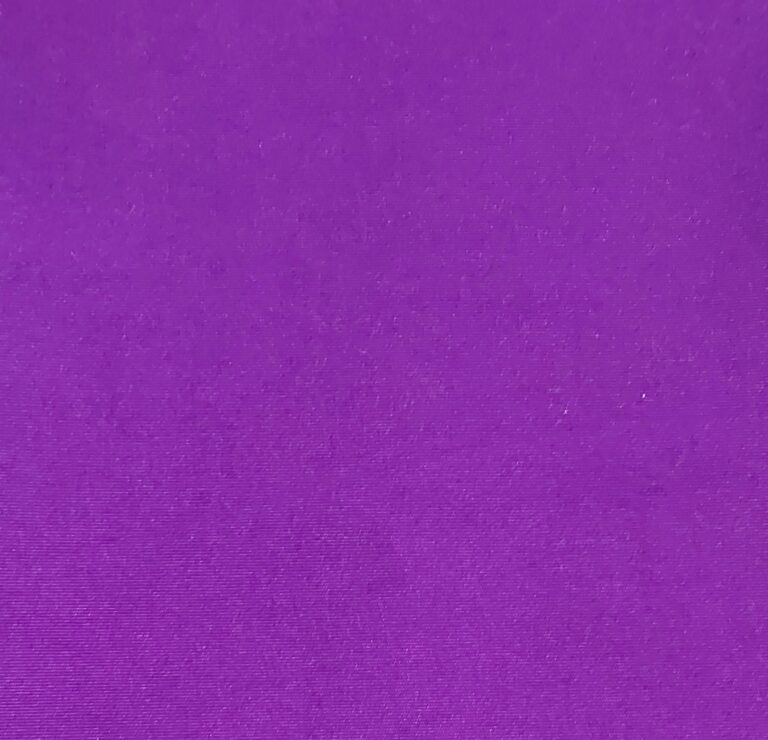 Solid purple textured fabric close-up