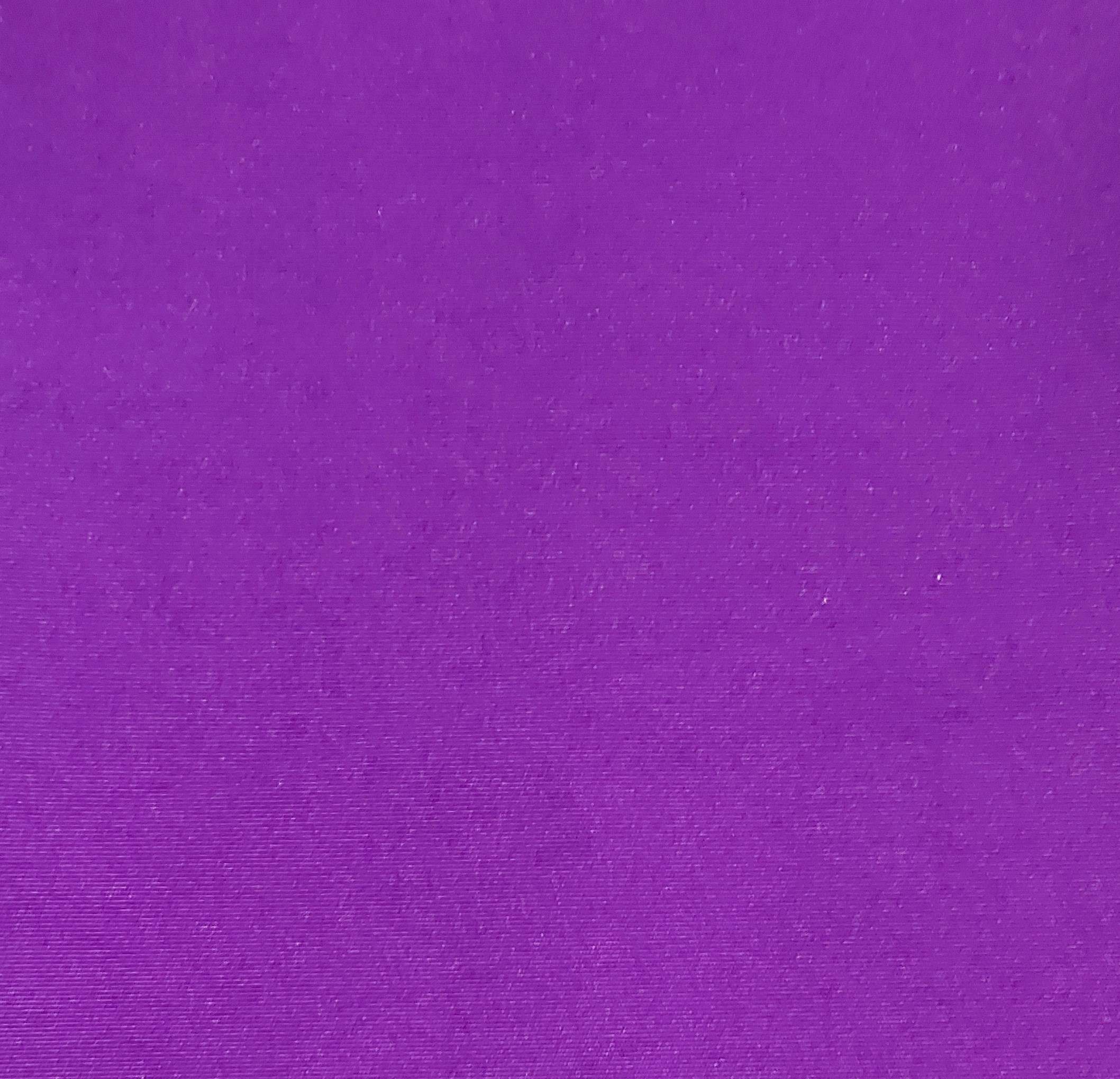 Solid purple textured fabric close-up.